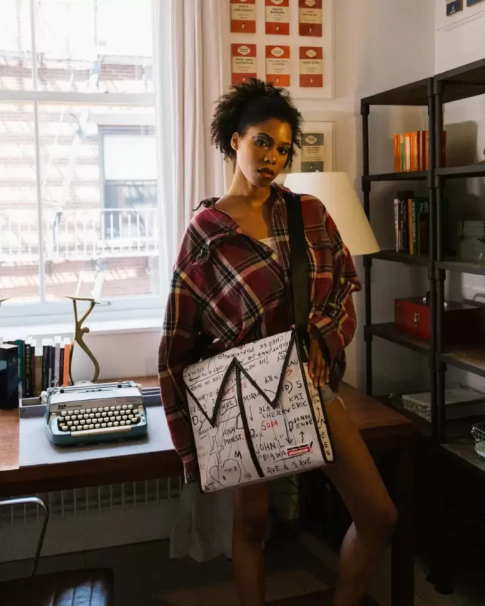 OFFICIAL BASQUIAT UNTITLED (CHEESE POPCORN) 1983 SLING MESSENGER OFFICIAL BASQUIAT UNTITLED (CHEESE POPCORN) 1983 SLING MESSENGER